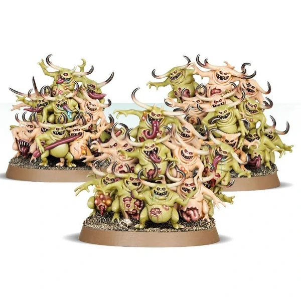 hordes of small green and yellow smiling small daemons with red tongues - nurglings