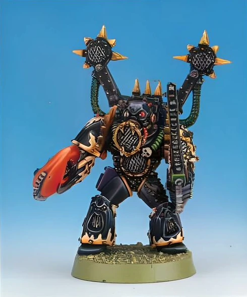 A miniature emperor;s children noise marine with a large claw, speaker mouth and chainsword with sonic backpack.